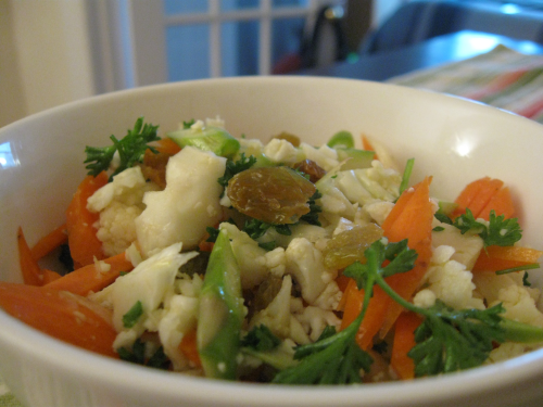 Adding herbs and acids like vinegar or lemon juice helps remove the cauliflower odor from the raw cauliflower salad 